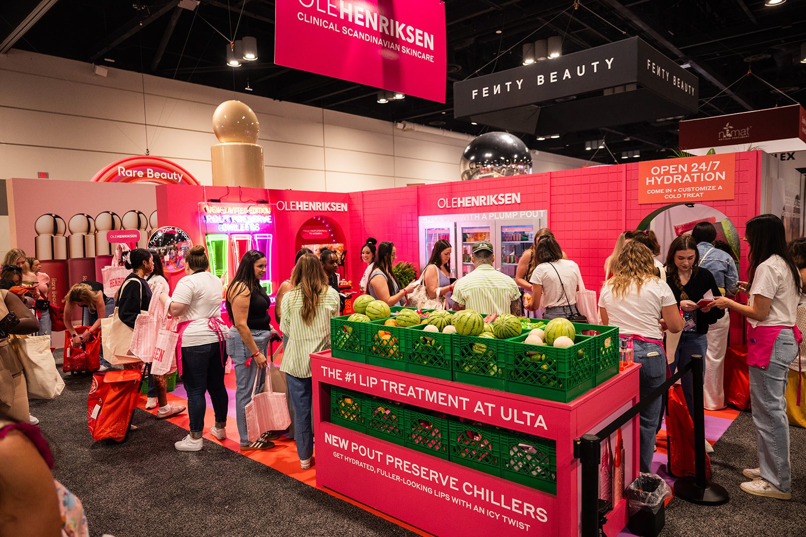 Ole Henriksen activation overview with bright pink branded build and guest traffic