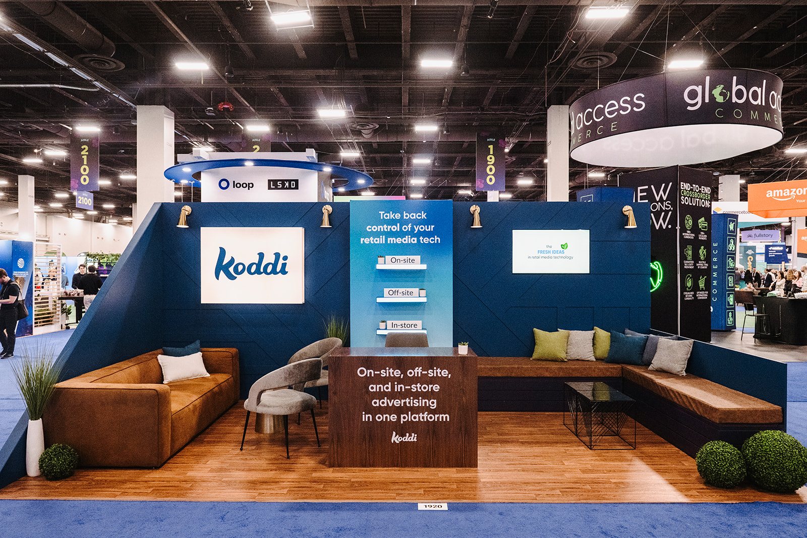 Koddi lounge booth at Shoptalk with branded seating and displays